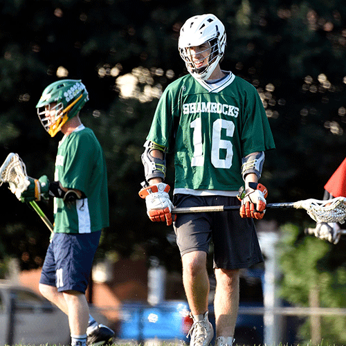 Shawn and Zack playing lacrosse